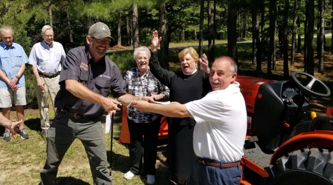 Parish Rallies Community to Buy Tractor for Substance Recovery Center Garden