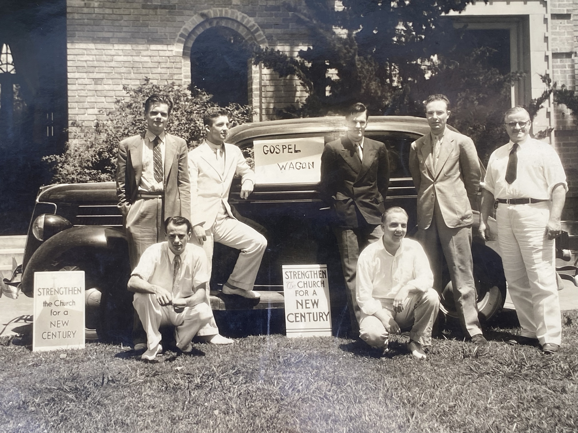 Historical photograph of students gathered around the Gospel Wagon.