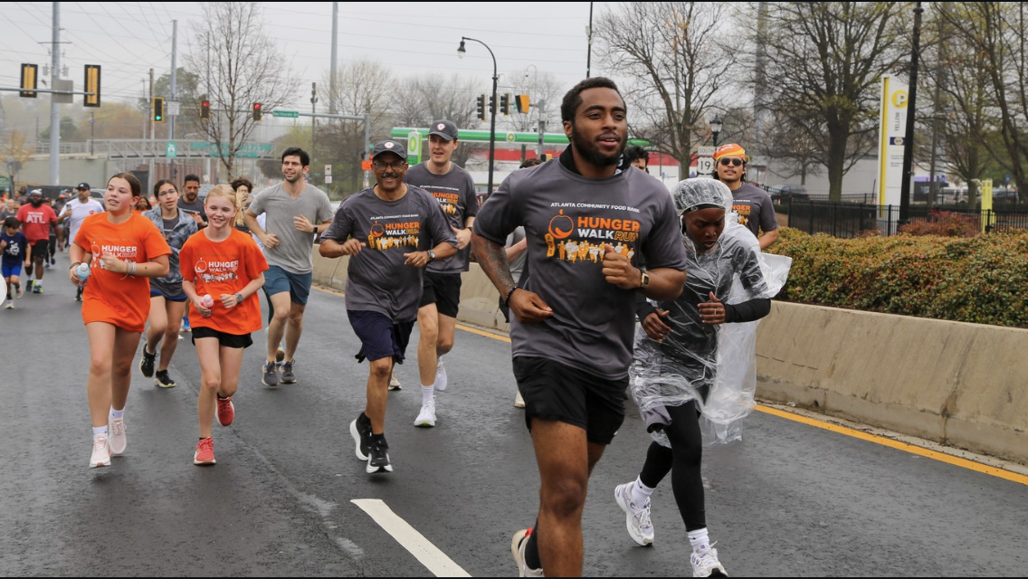 Participants run in the 2026 Hunger Walk Run.