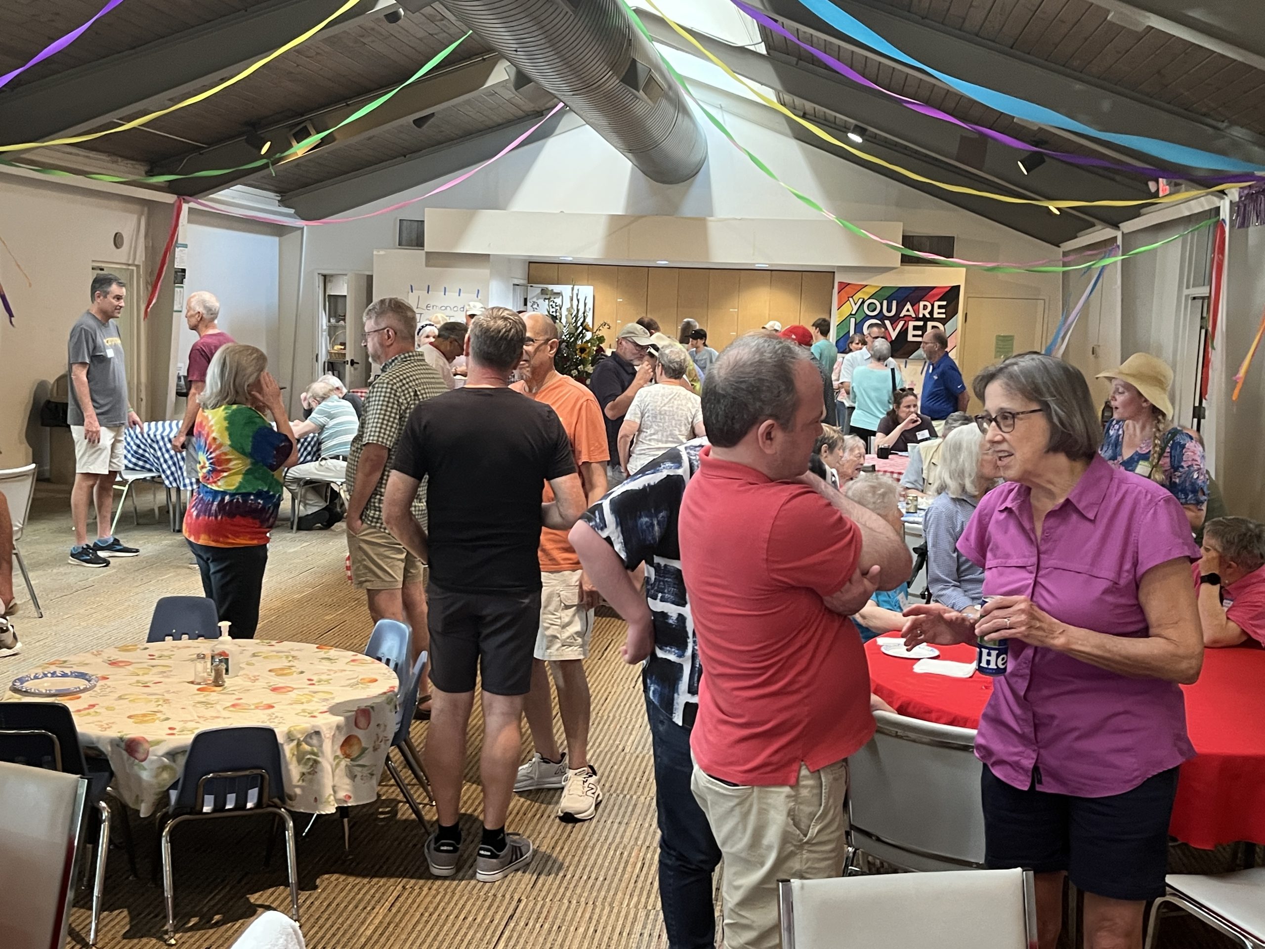Gathering in the parish hall at St. Bart’s homecoming